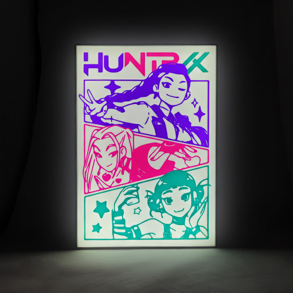 Lightbox design with 'HUNTRX' branding and the three characters of the KPOP Demon Hunters group on a white background. Lightbox has been turned on and is illuminated with a glow